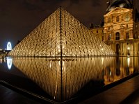 Le Louvre La Nuit The Glass Pyramid of the Louvre at night, with the Pavillion Richelieu wing in the background.